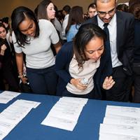 Student looking for her match result.